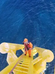 Man going down Oil Rig Ladder